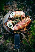Gruyere and spinach stuffed hicken wrapped in bacon with chanterelle mushrooms