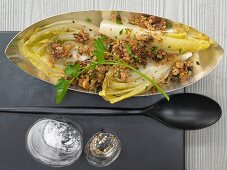 Grilled chicory with parmesan and walnut crumbs