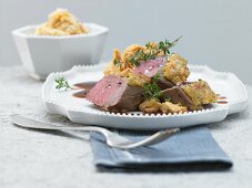 Saddle of venison with a herb nut crust and pumpkin puree