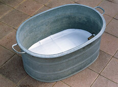 Zinc tub as water basin for children