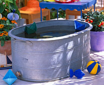 Tin tub as paddling pool for children. Bottom