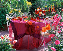 Festive dahlia table decoration on the terrace