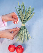 Standing wheat sheaf with apple (2/3)