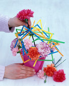 Carnation arrangement with colourful plastic straws (2/3)