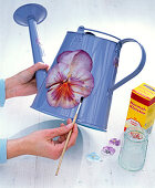 Napkin decoration, viola on metal watering can