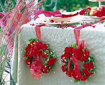 Wreaths of Rosa (roses, red), Cerastium (hornwort), Buxus (boxwood)