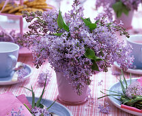Table decoration with Syringa (lilac)