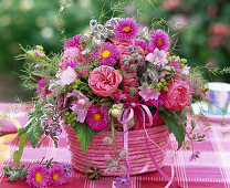 Bouquet in pink bast basket