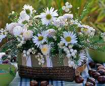 White autumn arrangement in the basket