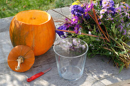 Purple autumn bouquet in pumpkin vase (1/3)