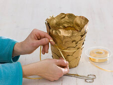 Planter with gilded leaves