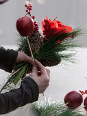 Red Christmas bouquet with amaryllis and apples (1/2)