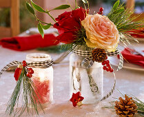 Small screw-top jars with ice flower spray as a lantern and as a vase with pinks