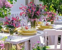 Table decoration with bouquets of Dicentra (Weeping Heart), Myosotis