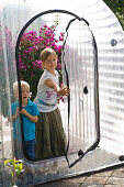 Inflatable greenhouse for overwintering potted plants