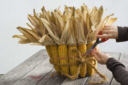 Bucket decorated with corncobs