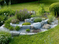 Herbal spiral of granite stones and gravel