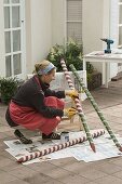 Colorfully painted clay pots on piles as beneficial shelter