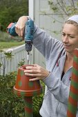 Colorfully painted clay pots on piles as beneficial shelter