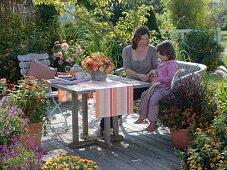 Mother and daughter on wooden bench