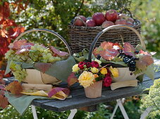 Table with grapes and apples in baskets