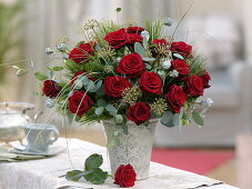 Winter bouquet of red pinks (roses), eucalyptus, hedera