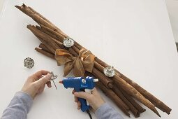 Unusual Advent arrangement of cinnamon sticks