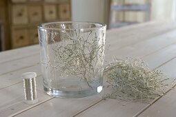 Glass with greis herb as lantern 2/4