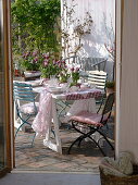 View of the spring terrace with a laid table