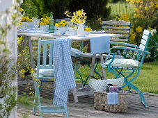 Yellow spring table decoration on the terrace