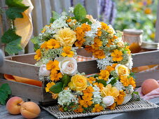 White-yellow late-summer wreath from Tagetes, Clematis