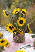 Table decoration with sunflowers and giant knotweed