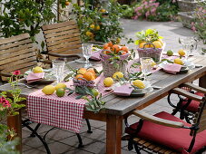 Table decoration with citrus fruits and olives