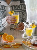 Hot orange juice in coarse glasses, orange pieces