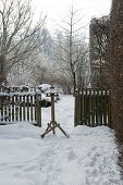 View of bird feeder in the snow-covered garden