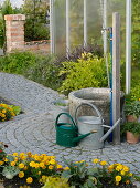 Fountain in the paved centre of the cottage garden