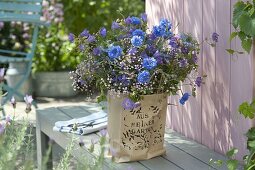 Summer bouquet in paper bag