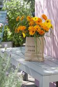 Bouquet of summer flowers in paper bag 2/2