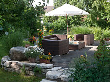 Seating on wooden terrace with drywall