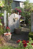 Open gate into the cottage garden