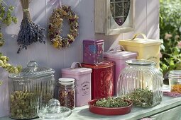 Prepare dried tea herbs and fill into tins and jars