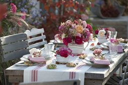 Autumnal rose table decoration on the terrace