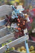 Autumn bouquet with Malus (ornamental apples), Rosa (rose hips)