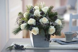 Winter bouquet with Rosa 'Dolomiti' (white roses), Abies (fir), Pinus