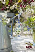 Easter bouquet of flowering branches, decorated with hand-painted Easter egg