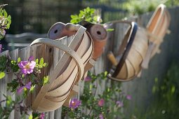 Chip baskets and clay pots at the farm garden fence