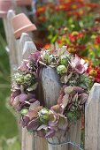 Wreath made of hydrangea flowers and maiden in the countryside