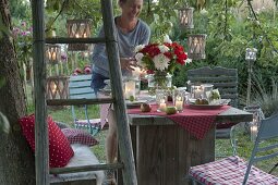 Set table under the tree in the garden