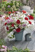 Late summer bouquet in enameled Bucket Cosmos