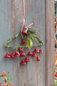 Wire coat hanger wrapped with grass, decorated